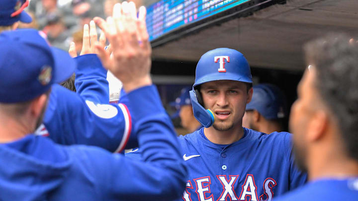 May 26, 2024; Minneapolis, Minnesota, USA;  Texas Rangers infielder Corey Seager (5) celebrates his two-run home run against the Minnesota Twins during the third inning at Target Field. Mandatory Credit: Nick Wosika-USA TODAY Sports