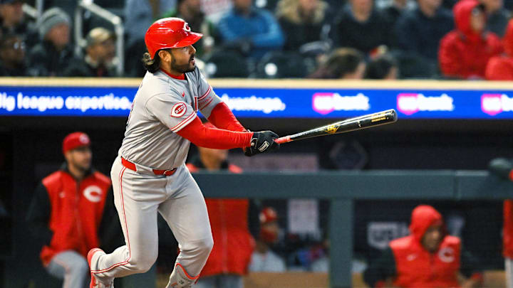 Apr 17, 2026; Minneapolis, Minnesota, USA; Cincinnati Reds third baseman Eugenio Suarez (28) hits a double in the fourth inning against the Minnesota Twins at Target Field. Mandatory Credit: Nick Wosika-Imagn Images