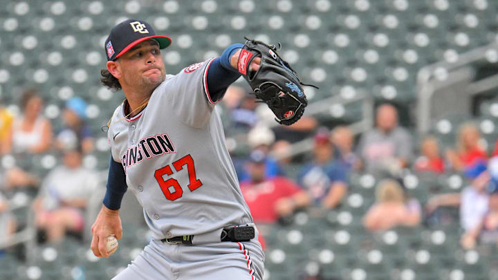 Jul 27, 2025; Minneapolis, Minnesota, USA;  Washington Nationals relief pitcher Kyle Finnegan (67) delivers a pitch against the Minnesota Twins during the ninth inning at Target Field. 