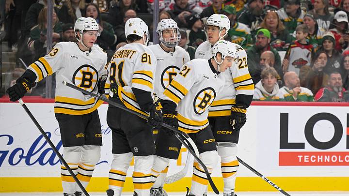 Dec 14, 2025; Saint Paul, Minnesota, USA; Boston Bruins forward Alex Steeves (21) celebrates after scoring a goal against the Minnesota Wild with forward Fraser Minten (93), forward Mikey Eyssimont (81), defensemen Charlie McAvoy (73), and forward Alex Steeves (21) during the third period at Grand Casino Arena. Mandatory Credit: Nick Wosika-Imagn Images