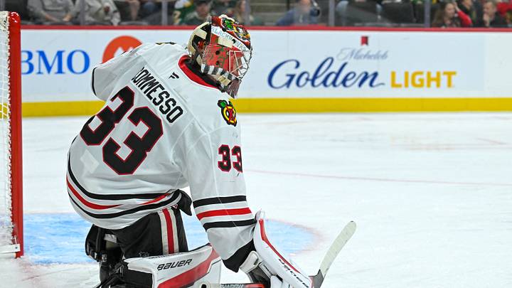 Sep 28, 2025; Saint Paul, Minnesota, USA;  Chicago Blckkawks goalie Drew Commesso (33) collects a loose puck against the Minnesota Wild during the second period at Xcel Energy Center. Mandatory Credit: Nick Wosika-Imagn Images