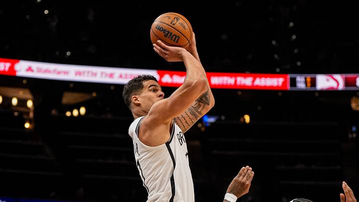 Feb 22, 2026; Atlanta, Georgia, USA; Brooklyn Nets forward Michael Porter Jr. (17) shoots over Atlanta Hawks guard Nickeil Alexander-Walker (7) during the first half at State Farm Arena. Mandatory Credit: Dale Zanine-Imagn Images
