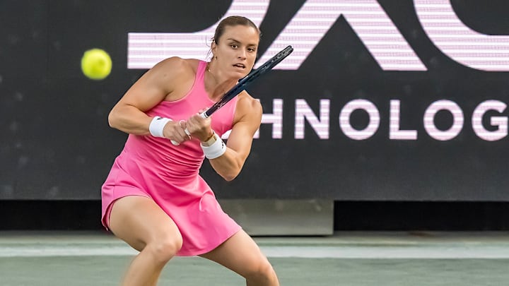 MARIA SAKKARI (GRE) returns a volley against Qinwen Zheng (3) (CHN) during the Credit One Charleston Open.