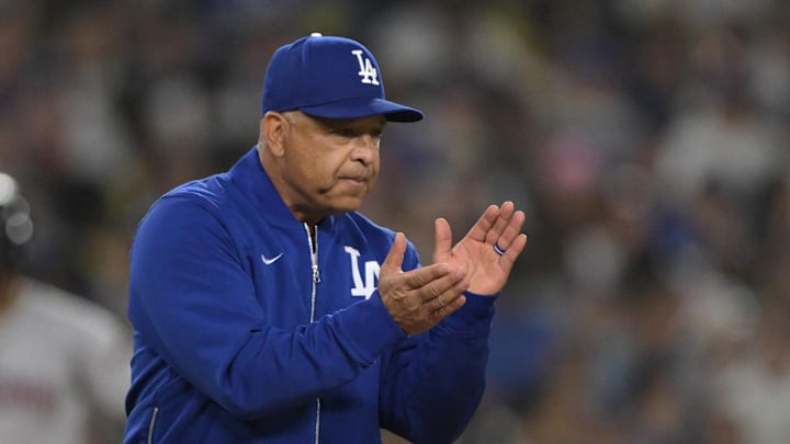 May 21, 2025; Los Angeles, California, USA;  Los Angeles Dodgers manager Dave Roberts (30) walks to the mound for a pitching change in the eighth inning against the Arizona Diamondbacks at Dodger Stadium. Mandatory Credit: Jayne Kamin-Oncea-Imagn Images