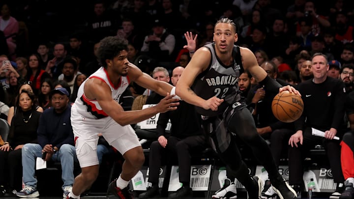 Feb 28, 2025; Brooklyn, New York, USA; Brooklyn Nets forward Jalen Wilson (22) drives to the basket against Portland Trail Blazers guard Scoot Henderson (00) during the first quarter at Barclays Center. Mandatory Credit: Brad Penner-Imagn Images