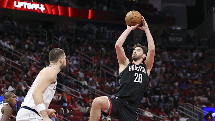 Nov 15, 2024; Houston, Texas, USA; Houston Rockets center Alperen Sengun (28) shoots the ball as Los Angeles Clippers center Ivica Zubac (40) defends during the third quarter at Toyota Center. Mandatory Credit: Troy Taormina-Imagn Images