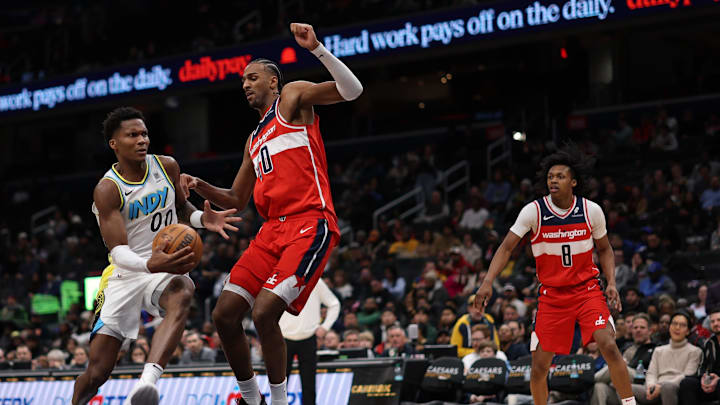 Feb 12, 2025; Washington, District of Columbia, USA; Indiana Pacers guard Bennedict Mathurin (00) drives to the basket as Washington Wizards forward Alex Sarr (20) defends in the fourth quarter at Capital One Arena. Mandatory Credit: Geoff Burke-Imagn Images