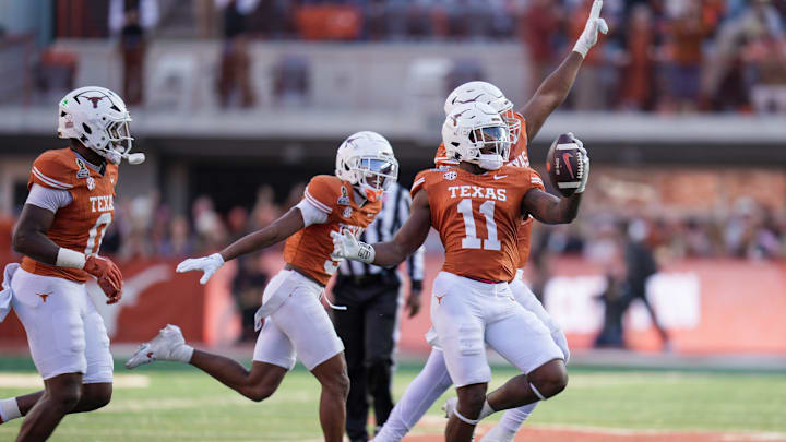 Texas Longhorns linebacker Colin Simmons (11) celebrates with teammates a turnover against Clemson Tigers in the first half of an NCAA College Football Playoffs first round game at Darrell K Royal Texas Memorial Stadium, Austin, Texas, Saturday, Dec. 21, 2024.