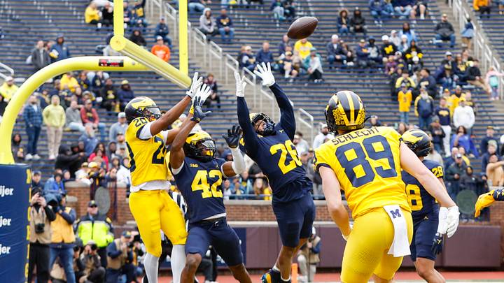 Apr 18, 2026; Ann Arbor, MI, USA; Michigan Wolverines Taylor Tatum (26) and Jeffrey Chukwu (42) block a pass meant for Jaylen Pile (20) during the second half at Michigan Stadium. Mandatory Credit: Brian Bradshaw Sevald-Imagn Images