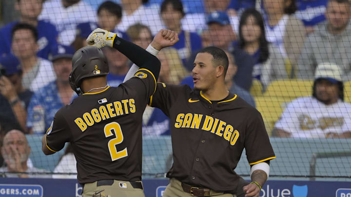 Jun 19, 2025; Los Angeles, California, USA; San Diego Padres shortstop Xander Bogaerts (2) celebrates a solo home run with third base Manny Machado (13) during the second inning against the Los Angeles Dodgers at Dodger Stadium. Mandatory Credit: Jayne Kamin-Oncea-Imagn Images Jun 19, 2025; Los Angeles, California, USA; San Diego Padres shortstop Xander Bogaerts (2) celebrates a solo home run with third base Manny Machado (13) during the second inning against the Los Angeles Dodgers at Dodger Stadium. Mandatory Credit: Jayne Kamin-Oncea-Imagn Images