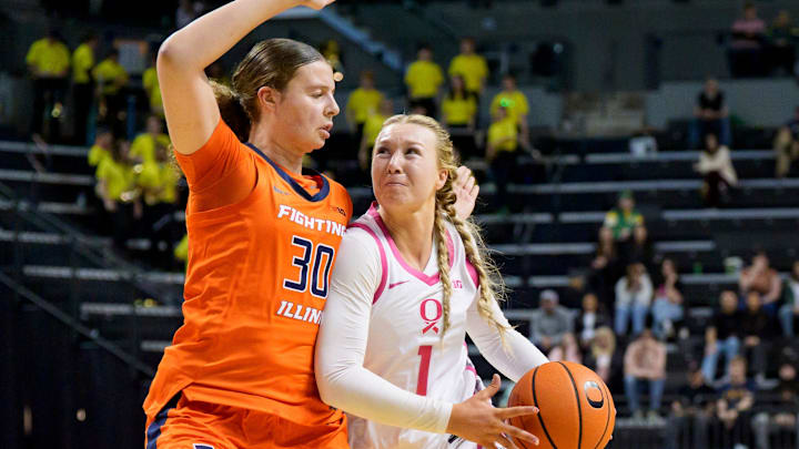 Oregon forward Mia Jacobs, right, presses past Illinois forward Cearah Parchment as the Oregon Ducks host the Illinois Fighting Illini on Feb. 4, 2026, at Matthew Knight Arena in Eugene, Oregon.