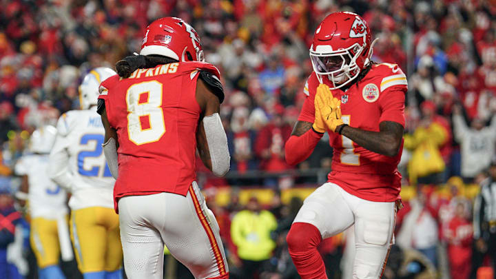 Dec 8, 2024; Kansas City, Missouri, USA; Kansas City Chiefs wide receiver DeAndre Hopkins (8) celebrates with wide receiver Xavier Worthy (1) after scoring against the Los Angeles Chargers during the first half at GEHA Field at Arrowhead Stadium. Mandatory Credit: Denny Medley-Imagn Images