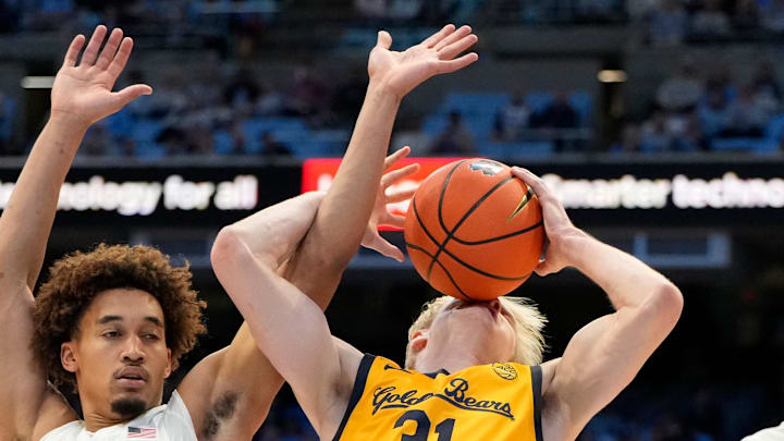 Cal's Rytis Petraitis (31) tries to control the ball against Seth Trimble.