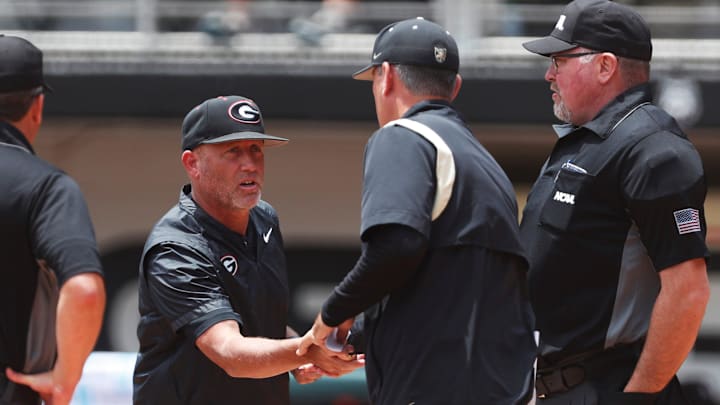 Georgia coach Wes Johnson shakes hand with Army coach Chris Tracz before a NCAA Athens Regional baseball game against Army in Athens, Ga., on Friday, May 31, 2024. Georgia won 8-7.