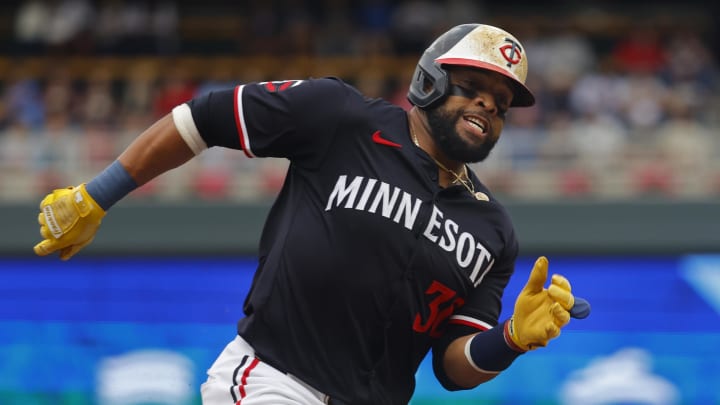 Minnesota Twins first baseman Carlos Santana (30) rounds third base on his way to scoring against the Tampa Bay Rays in the second inning at Target Field on June 20.