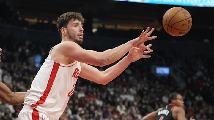 Dec 22, 2024; Toronto, Ontario, CAN; Houston Rockets center Alperen Sengun (28) passes the ball against the Toronto Raptors during the first half at Scotiabank Arena. Mandatory Credit: John E. Sokolowski-Imagn Images