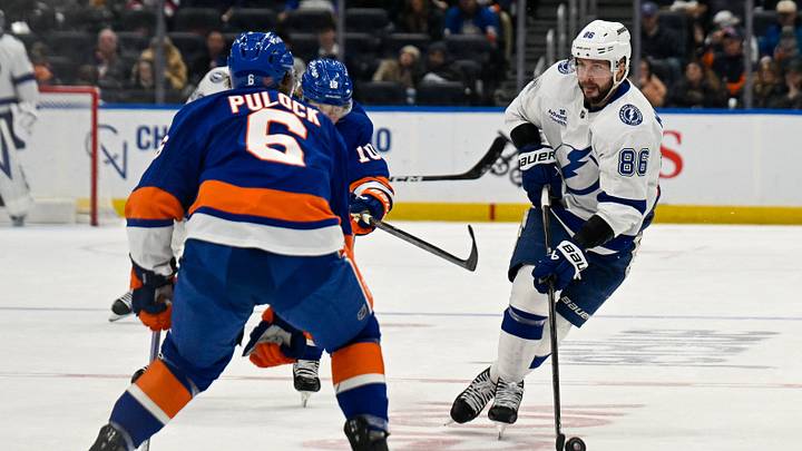 Dec 13, 2025; Elmont, New York, USA; Tampa Bay Lightning right wing Nikita Kucherov (86) skated into the zone defended by New York Islanders defenseman Ryan Pulock (6) during during the third period at UBS Arena. Mandatory Credit: Dennis Schneidler-Imagn Images Dec 13, 2025; Elmont, New York, USA; Tampa Bay Lightning right wing Nikita Kucherov (86) skated into the zone defended by New York Islanders defenseman Ryan Pulock (6) during during the third period at UBS Arena. Mandatory Credit: Dennis Schneidler-Imagn Images