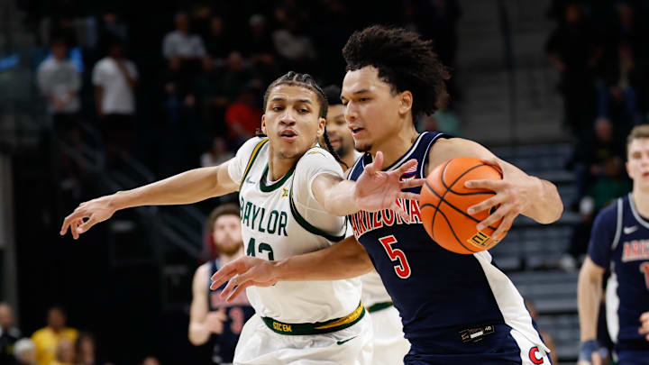 Feb 24, 2026; Waco, Texas, USA;  Arizona Wildcats guard Brayden Burries (5) is fouled by Baylor Bears guard Cameron Carr (43) during the second half at Paul and Alejandra Foster Pavilion. Mandatory Credit: Chris Jones-Imagn Images