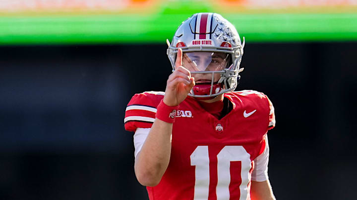 Ohio State Buckeyes quarterback Julian Sayin (10) motions for a first down during the NCAA football game against the Rutgers Scarlet Knights at Ohio Stadium in Columbus on Nov. 22, 2025. Ohio State won 42-9. Ohio State Buckeyes quarterback Julian Sayin (10) motions for a first down during the NCAA football game against the Rutgers Scarlet Knights at Ohio Stadium in Columbus on Nov. 22, 2025. Ohio State won 42-9.