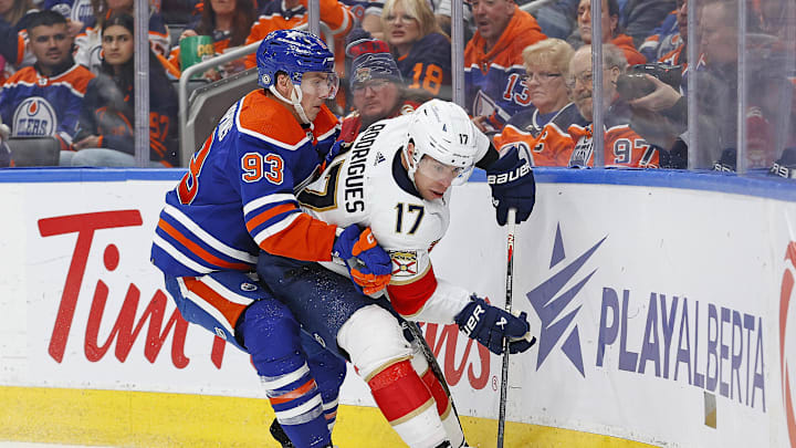 Florida Panthers forward Evan Rodrigues (17) and Edmonton Oilers forward Ryan Nugent-Hopkins (93) 