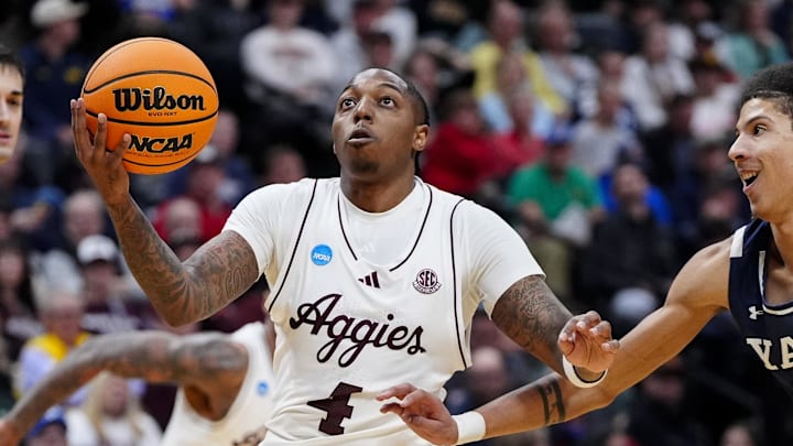 March 20, 2025; Denver, CO, USA; Texas A&M Aggies guard Wade Taylor IV (4) goes to the basket against the Yale Bulldogs during the second half at Ball Arena. Mandatory Credit: Ron Chenoy-Imagn Images