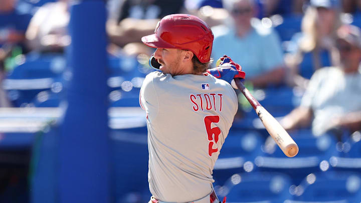Philadelphia Phillies second base Bryson Stott (5) hits an rbi single against the Toronto Blue Jays in the sixth inning during spring training at TD Ballpark. 