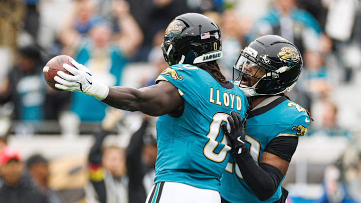 Dec 7, 2025; Jacksonville, Florida, USA; Jacksonville Jaguars linebacker Devin Lloyd (0) and Jacksonville Jaguars safety Eric Murray (29) celebrate after an interception against the Indianapolis Colts during the first half at EverBank Stadium. Mandatory Credit: Matt Pendleton-Imagn Images