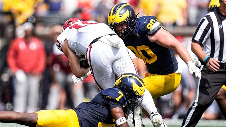 Michigan defensive end John Henry Daley (90) tackles Oklahoma quarterback John Mateer (10) during the first half at Michigan Stadium in Ann Arbor on Saturday, Sept. 12, 2026. Michigan defensive end John Henry Daley (90) tackles Oklahoma quarterback John Mateer (10) during the first half at Michigan Stadium in Ann Arbor on Saturday, Sept. 12, 2026.