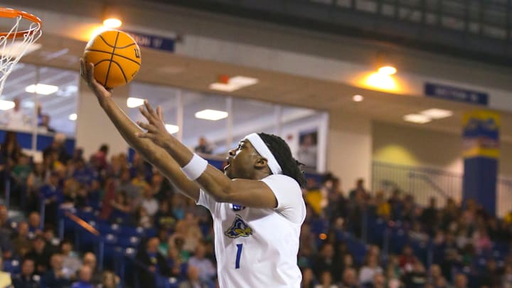 Delaware's Gerald Drumgoole Jr. goes to the hoop in front of teammate Christian Ray in the first half. 
