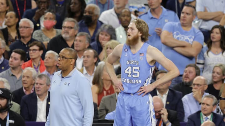 Apr 4, 2022; New Orleans, LA, USA; North Carolina Tar Heels head coach Hubert Davis and forward Brady Manek (45) look on in the first half against the Kansas Jayhawks during the 2022 NCAA men's basketball tournament Final Four championship game at Caesars Superdome. Mandatory Credit: Stephen Lew-Imagn Images