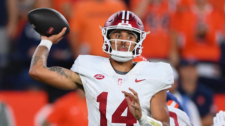 Sep 20, 2024; Syracuse, New York, USA; Stanford Cardinal quarterback Ashton Daniels (14) passes against the Syracuse Orange during the first half at the JMA Wireless Dome. Mandatory Credit: Rich Barnes-Imagn Images