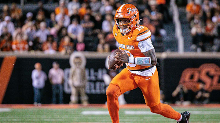 Oct 18, 2025; Stillwater, Oklahoma, USA; Oklahoma State Cowboys quarterback Sam Jackson V (18) runs the ball during the second half against the Cincinnati Bearcats at Boone Pickens Stadium. Mandatory Credit: William Purnell-Imagn Images Oct 18, 2025; Stillwater, Oklahoma, USA; Oklahoma State Cowboys quarterback Sam Jackson V (18) runs the ball during the second half against the Cincinnati Bearcats at Boone Pickens Stadium. Mandatory Credit: William Purnell-Imagn Images