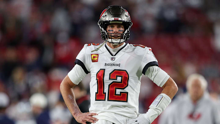 Jan 16, 2023; Tampa, Florida, USA; Tampa Bay Buccaneers quarterback Tom Brady (12) looks on before a  wild card game against the Dallas Cowboys at Raymond James Stadium. Mandatory Credit: Nathan Ray Seebeck-Imagn Images