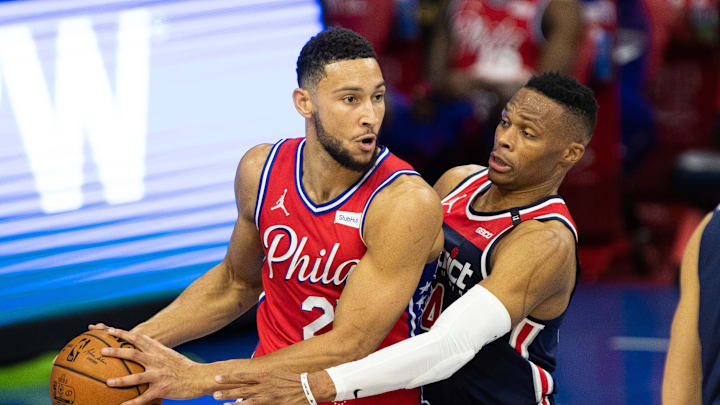Dec 23, 2020; Philadelphia, Pennsylvania, USA; Philadelphia 76ers guard Ben Simmons (25) controls the ball against Washington Wizards guard Russell Westbrook (4) during the second quarter at Wells Fargo Center. Mandatory Credit: Bill Streicher-Imagn Images