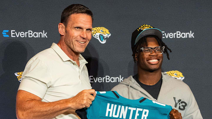 The Jacksonville Jaguars’ first-round pick, Colorado Buffaloes wide receiver and defensive back Travis Hunter, right, poses with Tony Boselli, Executive Vice President of Football Operations, left, with his jersey during a press conference Friday, March 25, 2025 at Miller Electric Center in Jacksonville, Fla. 
