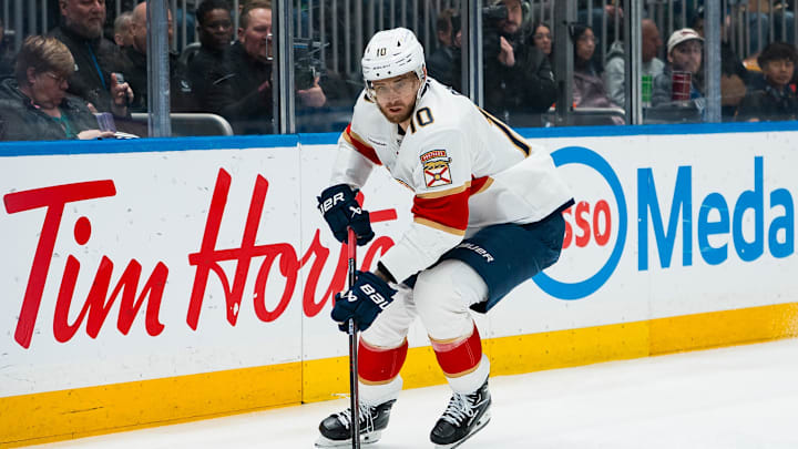 Mar 17, 2026; Vancouver, British Columbia, CAN; Florida Panthers forward A.J. Greer (10) handles the puck against the Vancouver Canucks in the first period at Rogers Arena. Mandatory Credit: Bob Frid-Imagn Images