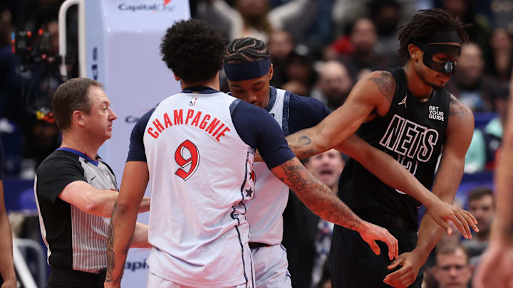 Feb 24, 2025; Washington, District of Columbia, USA; Washington Wizards guard Bilal Coulibaly (0) separates Wizards forward Justin Champagnie (9) and Brooklyn Nets center Nic Claxton (33) in the second half at Capital One Arena. Mandatory Credit: Geoff Burke-Imagn Images Feb 24, 2025; Washington, District of Columbia, USA; Washington Wizards guard Bilal Coulibaly (0) separates Wizards forward Justin Champagnie (9) and Brooklyn Nets center Nic Claxton (33) in the second half at Capital One Arena. Mandatory Credit: Geoff Burke-Imagn Images