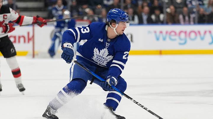 Oct 21, 2025; Toronto, Ontario, CAN; Toronto Maple Leafs forward Matthew Knies (23) controls the puck against the New Jersey Devils during the first period at Scotiabank Arena. Mandatory Credit: John E. Sokolowski-Imagn Images
