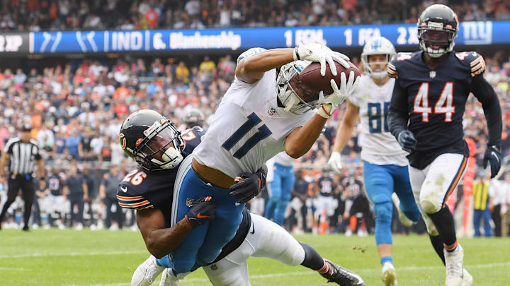 Oct 3, 2021; Chicago, Illinois, USA; Detroit Lions wide receiver Kalif Raymond (11) scores a touchdown in the second half against Chicago Bears defensive back Deon Bush (26) at Soldier Field. Mandatory Credit: Quinn Harris-Imagn Images