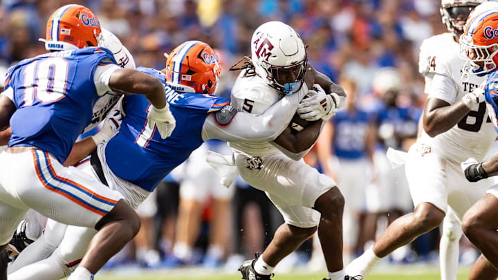 Florida Gators defensive end Justus Boone (1) tackles Texas A&M Aggies running back Amari Daniels (5) during September's game at Ben Hill Griffin Stadium in Gainesville, Fla. Florida Gators defensive end Justus Boone (1) tackles Texas A&M Aggies running back Amari Daniels (5) during September's game at Ben Hill Griffin Stadium in Gainesville, Fla.