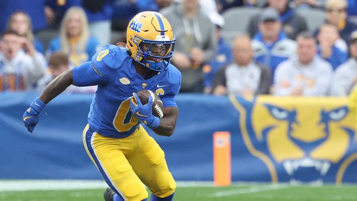 Nov 15, 2025; Pittsburgh, Pennsylvania, USA;  Pittsburgh Panthers running back Desmond Reid (0) runs after catch against the Notre Dame Fighting Irish during the first quarter at Acrisure Stadium. Mandatory Credit: Charles LeClaire-Imagn Images