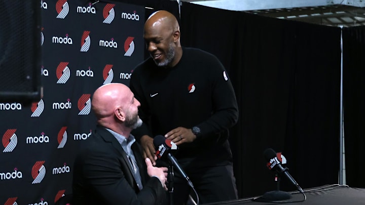 Apr 13, 2025; Portland, Oregon, USA; Portland Trail Blazers head coach Chauncey Billups interacts with Trail Blazers’ general manager Joe Cronin at the conclusion of a press conference before Portland plays their last season game against Los Angeles Lakers at Moda Center. Mandatory Credit: Jaime Valdez-Imagn Images