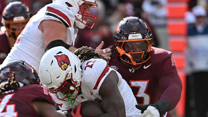 Nov 1, 2025; Blacksburg, Va.; Virginia Tech linebacker Kaleb Spencer (3) tackles Louisville running back Keyjuan Brown (22).
