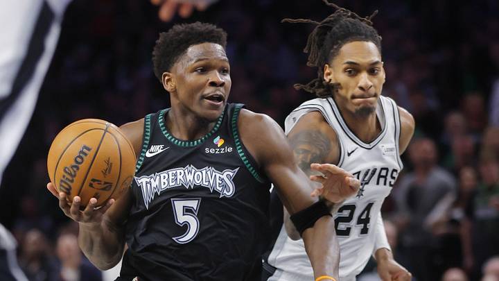 May 10, 2026; Minneapolis, Minnesota, USA; Minnesota Timberwolves guard Anthony Edwards (5) goes to the basket past San Antonio Spurs guard Devin Vassell (24) in the fourth quarter of game four of the second round of the 2026 NBA Playoffs at Target Center. Mandatory Credit: Bruce Kluckhohn-Imagn Images