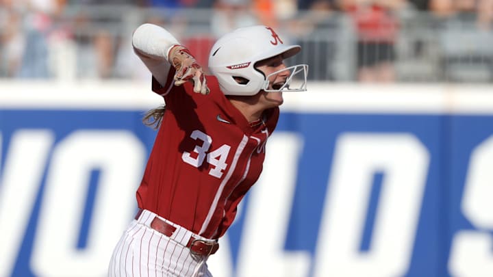 Alabama catcher Marlie Giles celebrates after driving in a run on a double in the first inning against Duke. Giles would later add a solo home run to lead the Crimson Tide to a 2-1 win, which eliminated the Blue Devils on Day 2.