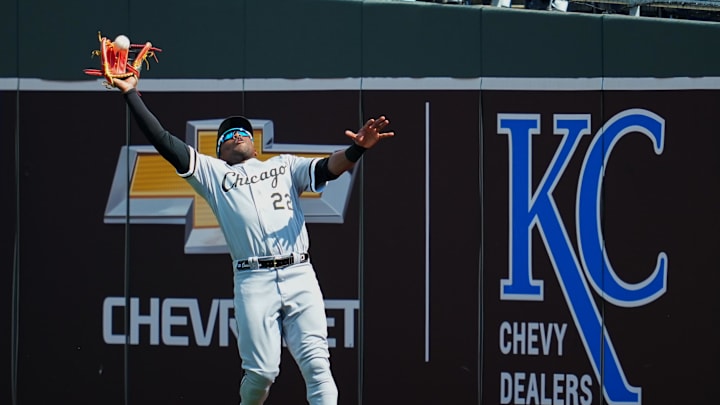Kansas City, Missouri, USA; Chicago White Sox right fielder Oscar Colas (22) catches a fly ball during the sixth inning against the Kansas City Royals at Kauffman Stadium.