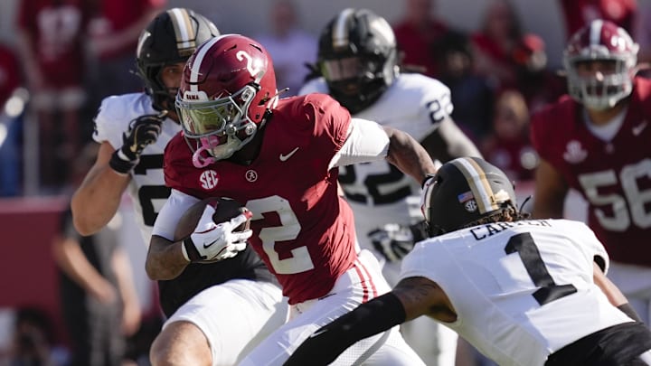 Oct 4, 2025; Tuscaloosa, Alabama, USA;  Alabama wide receiver Ryan Williams (2) makes a catch and run for a first down with Vanderbilt defensive back Dontae Carter (1) closing at Saban Field at Bryant-Denny Stadium. Mandatory Credit: Gary Cosby Jr.-USA TODAY Network via Imagn Images