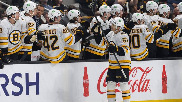 Oct 13, 2026; San Jose, California, USA;  Boston Bruins center Matthew Poitras (51) celebrates with teammates after scoring a goal during the second period against the San Jose Sharks at SAP Center at San Jose.  Mandatory Credit: Stan Szeto-Imagn Images