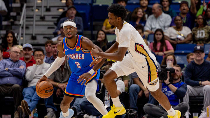 Nov 17, 2025; New Orleans, Louisiana, USA; Oklahoma City Thunder guard Shai Gilgeous-Alexander (2) dribbles against New Orleans Pelicans forward Herbert Jones (2) during the first half at Smoothie King Center. Mandatory Credit: Stephen Lew-Imagn Images