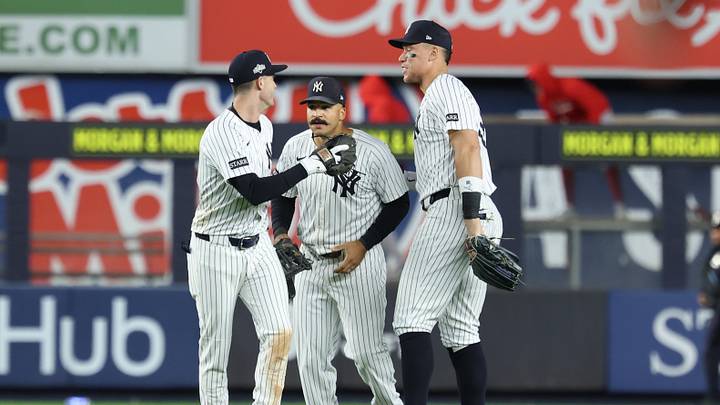 Oct 2, 2025; Bronx, New York, USA; New York Yankee outfielders Cody Bellinger (35), Trent Grisham (12) and Aaron Judge (99) react  following game three of the Wildcard round for the 2025 MLB playoffs against the Boston Red Sox at Yankee Stadium. Mandatory Credit: Vincent Carchietta-Imagn Images